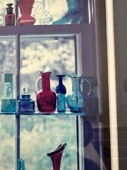 “Sunlit Memories in Colored Glass Bottles” Framed Photograph 21.5” X 25.5”