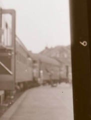 Great old negative – boy gets out of passenger car railway place?