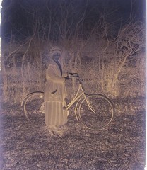 Bicycle driver woman with bicycle historical glass negative around 1920