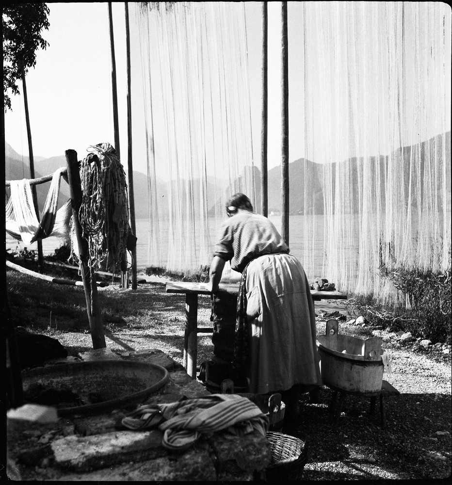 Salzkammergut , Austria, village, woman w traditional fishing net, by Eduard PEZ
