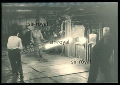 Glowing metal is processed in the steel plant – industrial technology – photo 10×7 cm