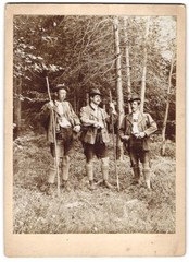 Photograph Three Hunters with Shotgun and Binoculars at the Edge of the Forest, Walking Stick, 1908