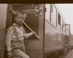 Great old negative – boy gets out of passenger car railway place?