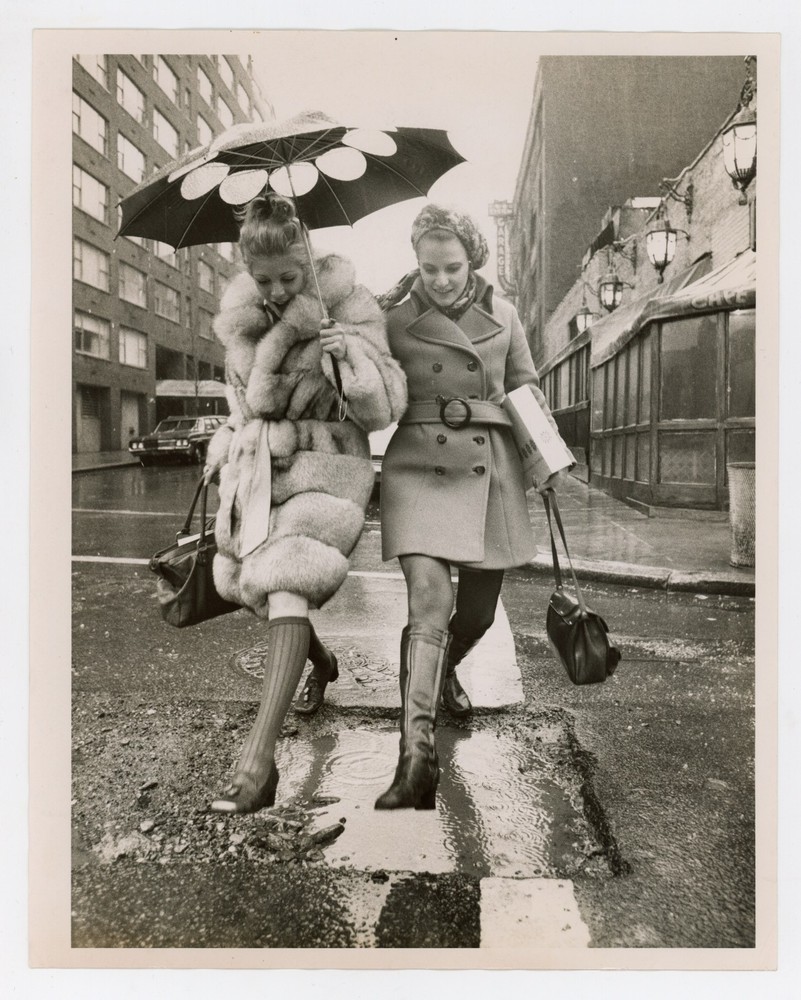 Two Women Jumping Puddle with Fur Coat Umbrella New York NYC 1970s Press Photo