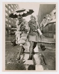 Two Women Jumping Puddle with Fur Coat Umbrella New York NYC 1970s Press Photo
