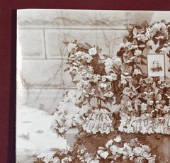 Antique Photograph Depicting a Woman’s Memorial with a Floral Arrangement