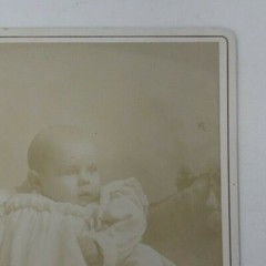 Antique Cabinet Card Photograph- Baby in a white dress sitting for a photograph