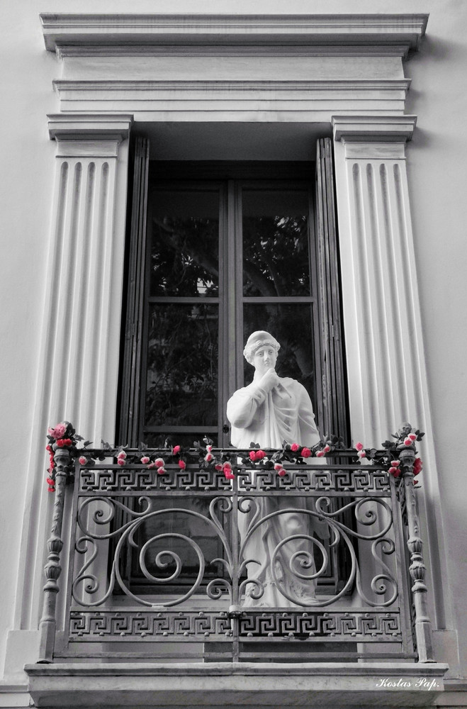 Signed photo of a Greek female statue thinking on a balcony