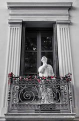 Signed photo of a Greek female statue thinking on a balcony