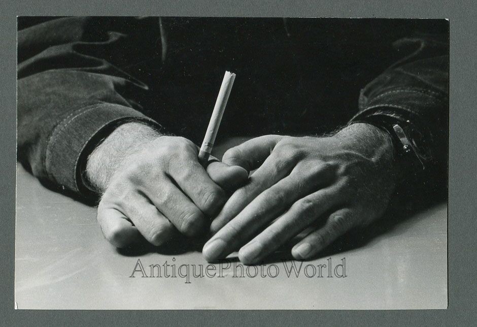 Hands holding a cigarette close up vintage art photo