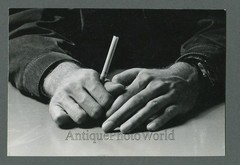 Hands holding a cigarette close up vintage art photo