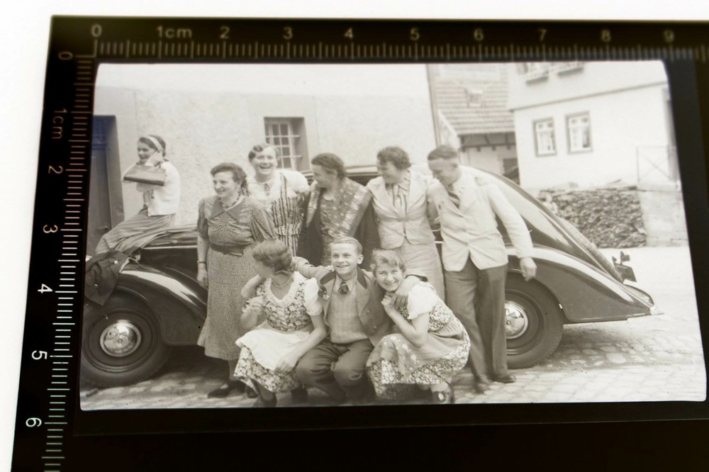 Great old negative – family posing with vintage – brand unknown to me