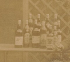 Photo on cardboard – gentleman with many bottles – around 1900