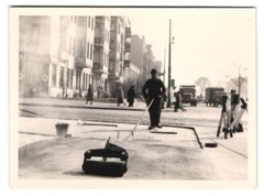 2 photographs road workers at work at an intersection