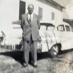 Vintage Black and White Photograph Man in Suit by Classic Car March 1959