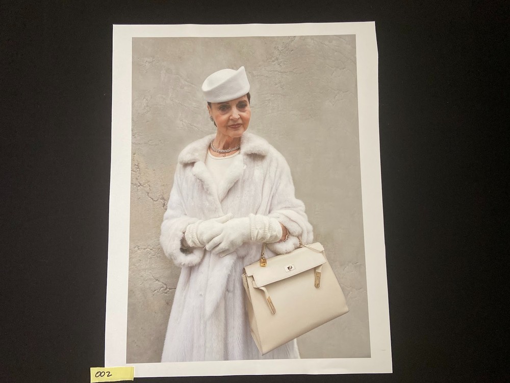 This is a 16×24 Portrait of a woman in a white coat with a purse