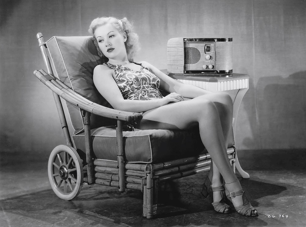 Betty Grable in the 1930s sits on Bamboo Chair with Old radio 8 x 10 Photograph