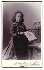 Photograph Joh. Graf, Winterthur, Niedergasse 13, girl in dress with a fo