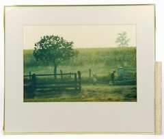 Photograph of farmer and son walking the fence line in front of corn field
