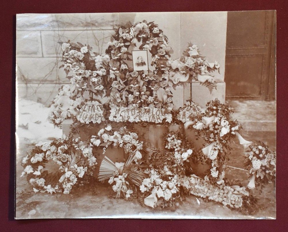 Antique Photograph Depicting a Woman’s Memorial with a Floral Arrangement