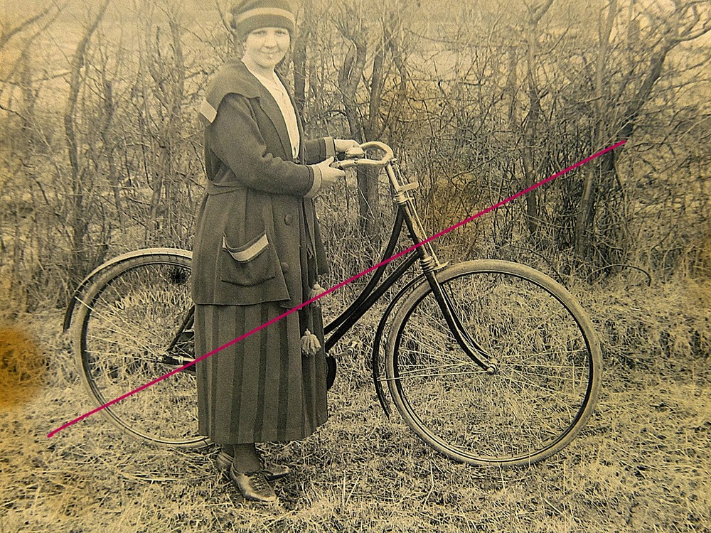 Bicycle driver woman with bicycle historical glass negative around 1920