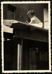Photograph Roofer, Young Woman Nails New Roofing Board On A Canopy 1953
