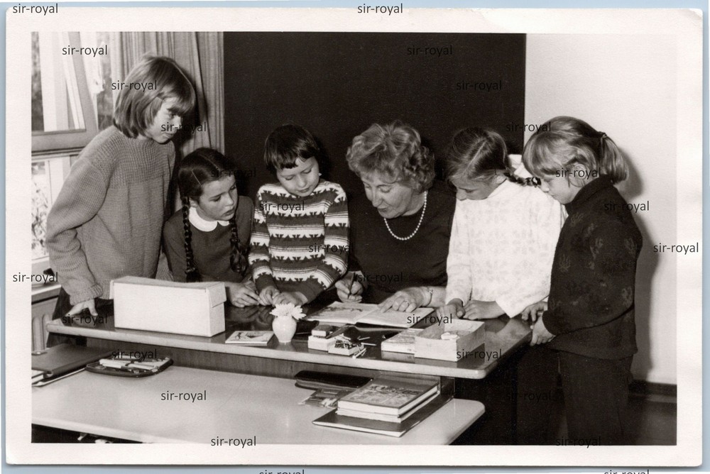 Student Surrounded Teacher at School Desk – 1970s – Photo 13x9cm
