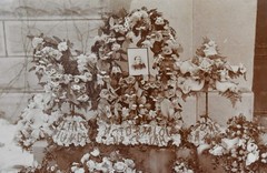 Antique Photograph Depicting a Woman’s Memorial with a Floral Arrangement