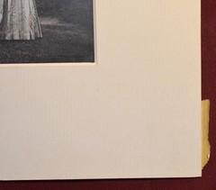 Vintage Photograph of a Woman Wearing a White Dress and a Black Hat