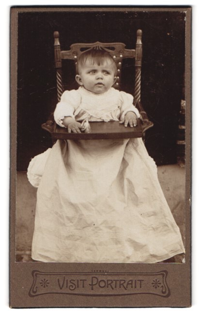Photography Portrait Toddler in Too Big Dress Sitting in Highchair