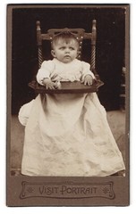Photography Portrait Toddler in Too Big Dress Sitting in Highchair