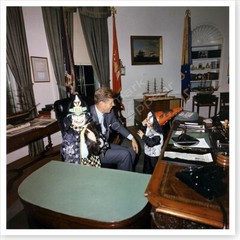 President John F. Kennedy Visited By His Kids In Halloween Costumes Photo