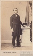 Portrait middle-class gentleman with glasses, top hat and whiskers, photograph. 1866