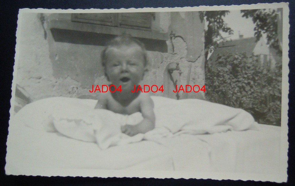 REAL PHOTO POSTCARD / CHILDREN’S PHOTO – SMALL CHILD (BABY) IN THE GARDEN