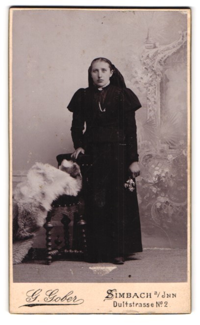 Photograph G. Gober, Simbach, Dultstraße 2, young woman in black with flowers