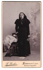Photograph G. Gober, Simbach, Dultstraße 2, young woman in black with flowers