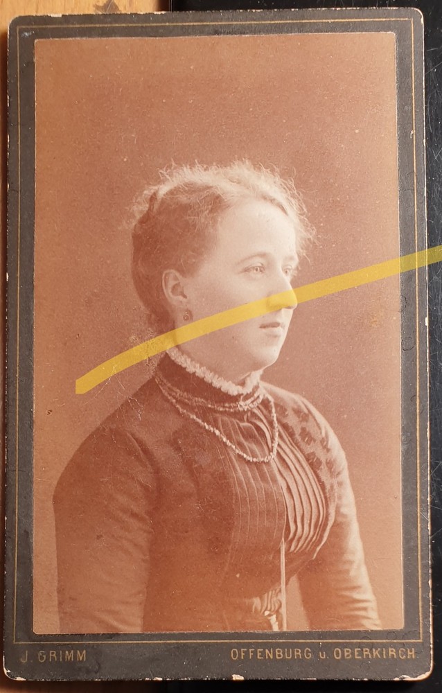 Young woman portrait from the side/CDV J. Grimm Offenburg and Oberkirch