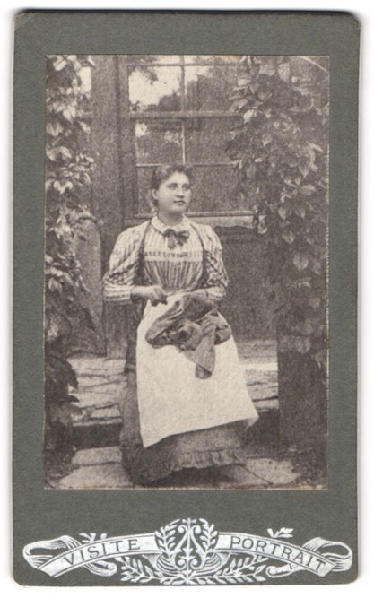 photograph maid in front of a glass door