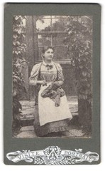 photograph maid in front of a glass door