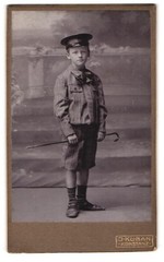 Photograph J. Kuban, Constance, Hussenstraße 26a, boy with umbrella cap and walking