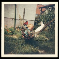 Small Child and White Rabbit in Hammock – Photo 9x9cm