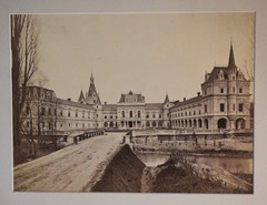 Vintage Black and White Photograph of a Large Building with a Courtyard