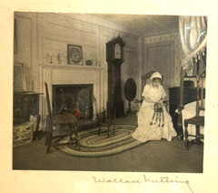 WALLACE NUTTING: FRAMED HAND COLORED PHOTO: INTERIOR LIVING ROOM SCENE W LADY