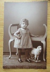 7 old portrait photos little girl with toy / ball and sheep around 1920