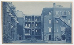 CYANOTYPE ARCHITECTURAL BUILDING WITH PORCHES. STRONG CONTRAST.