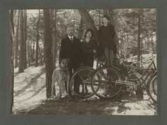 Family in woods with Great Dane dog and bicycles antique art photo