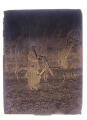 Bicycle driver woman with bicycle historical glass negative around 1920