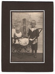 Photograph baby in pram with boy in sailor suit
