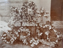 Antique Photograph Depicting a Woman’s Memorial with a Floral Arrangement