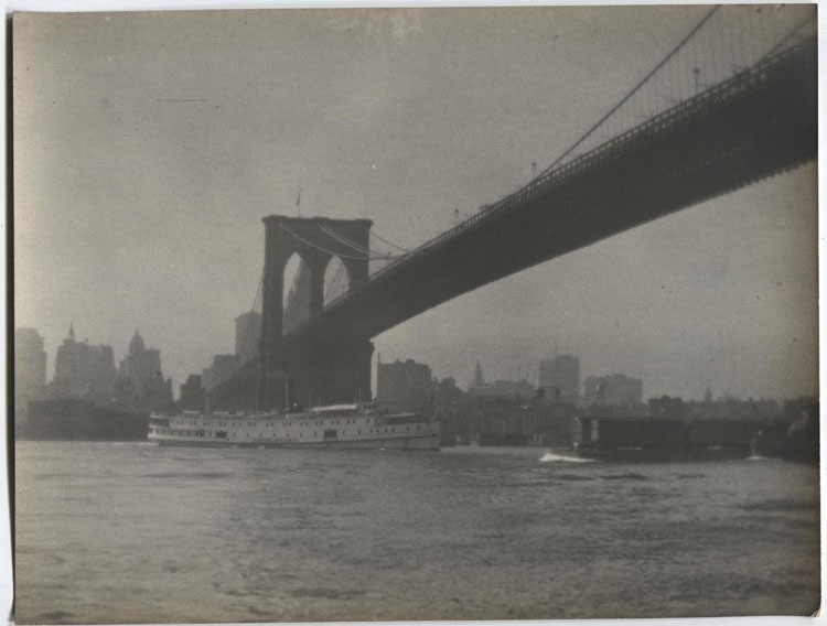 VINTAGE PHOTO PICTORIALIST BROOKLYN BRIDGE WITH BOAT PASSING UNDERNEATH.